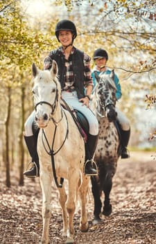 Portrait, women and horses in a forest, happiness and woods with animal care, stallion and countryside. Adventure, pets and girls with joy, activity and relax with hobby, bonding together and friends.