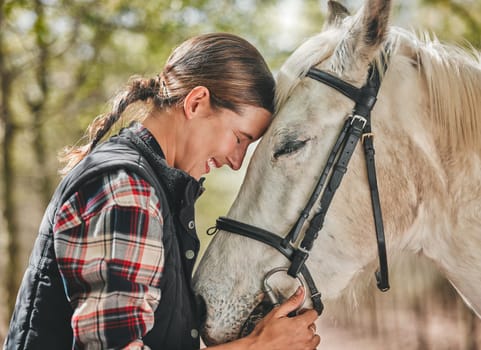 Happy woman with horse in forest, embrace in nature and love for animals, pets or dressage with trees. Equestrian sport, girl jockey or rider standing in woods for adventure, hug and smile on face