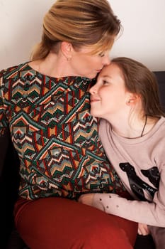 Mom and daughter hugging family together