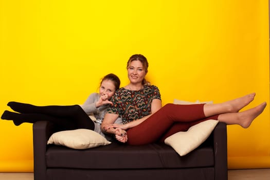 Mom and daughter hugging family together