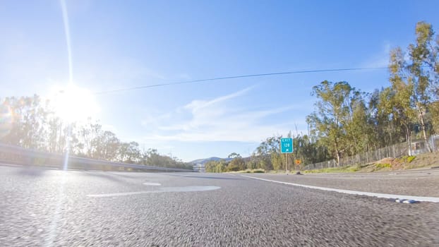 During the day, driving on HWY 101 near Arroyo Quemada Beach, California, offers scenic views of the surrounding coastal landscape.