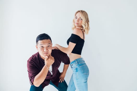 Man and woman posing on white background