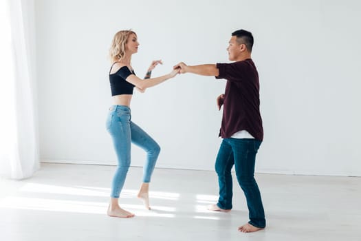 dancers man and woman dancing in studio workout