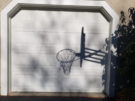 View of a Shadow of a Basketball Goal on Garage Door