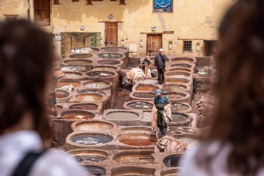 FES, MOROCCO - ARIL 10, 2023 - Famous tannery in the medina of Fes, where leather is being processed for generations, Morocco