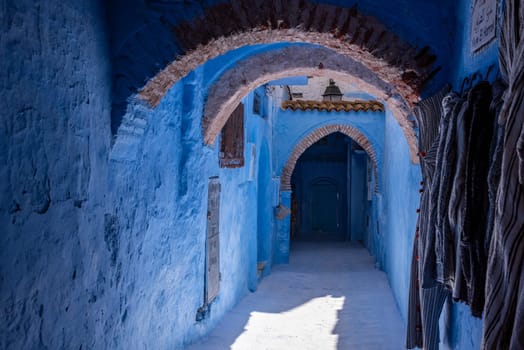 Vibrant blue colored alley in downtown Chefchaouen, Morocco