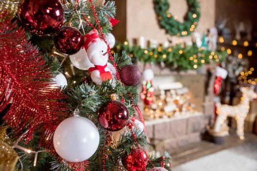 Christmas, New Year interior with red brick wall background, decorated fir tree with garlands and balls, dark drawer and deer figure