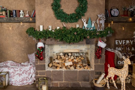 Christmas, New Year interior with red brick wall background, decorated fir tree with garlands and balls, dark drawer and deer figure