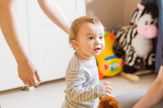 Excited Young Baby Boy in the bedroom