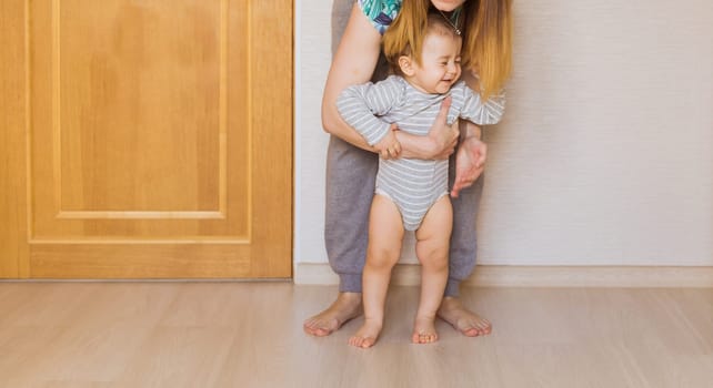 Beautiful smiling cute baby boy with his mother