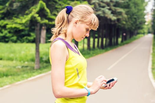 Woman checking fitness and health tracking wearable device.