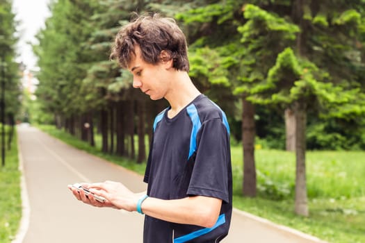 Man checking fitness and health tracking wearable device.