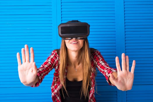 Woman in virtual reality headset enjoying her experience.