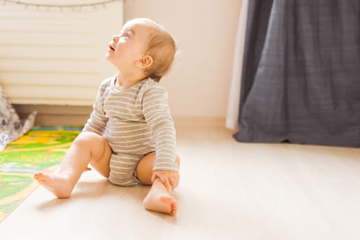 funny baby boy kid playing with toy