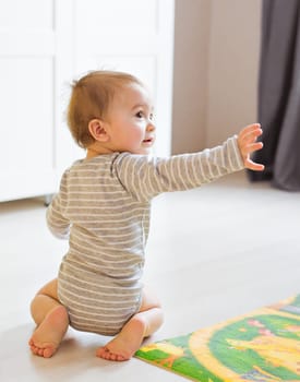 Portrait of cute newborn baby boy indoors