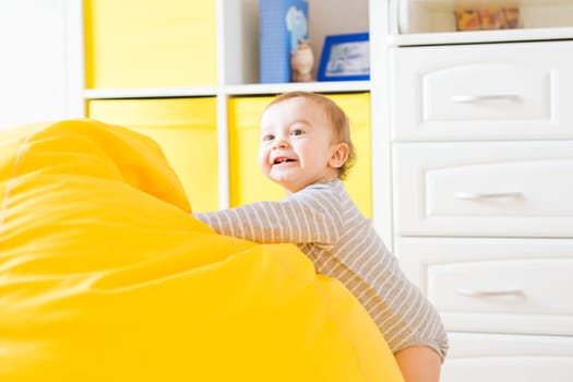 child and toddler concept - curious baby in the room.