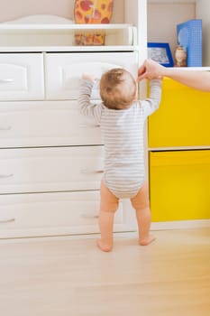 child and toddler concept - curious baby in the room.