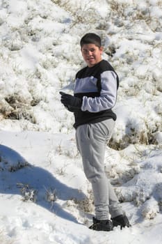 young latin guy in sportswear in the snow,ski resort.