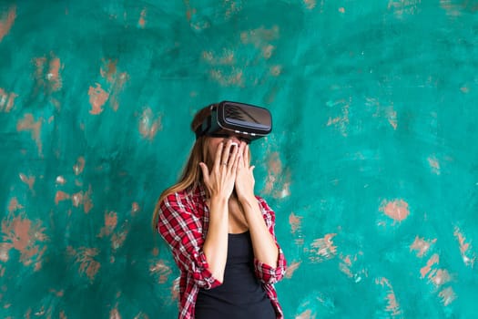 Young Woman feeling shocking for using the virtual reality device.