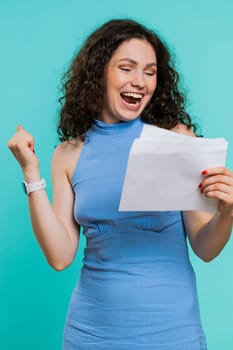 Young woman open envelope take out letter reads it feel happy. Career growth advance promotion bank loan approve, monetary award long-awaited invitation great news. Pretty adult girl on blue. Vertical