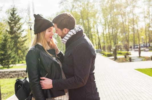 Happy pregnant couple in nature. loving couple outdoors