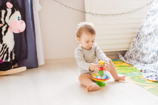 Cute caucasian baby boy in the bedroom