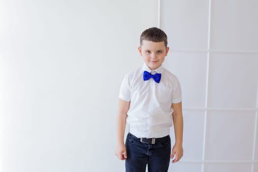 portrait of a boy with a butterfly on a white background