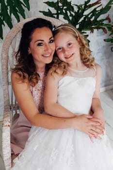 Mom and daughter portrait on background