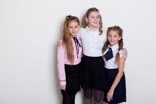 three girls at the board in class in class at school