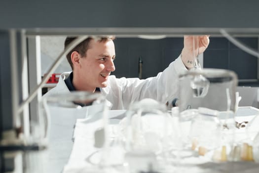 scientist conducts chemical experiments with liquids in the laboratory