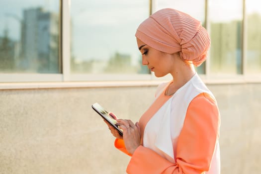 beautiful arabian girl with tablet computer. Muslim woman