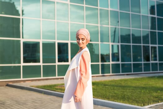 girl in abaya on the background of the business center.