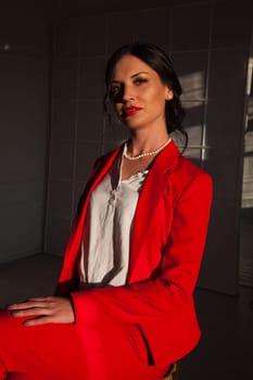 Portrait of a female student in a red business suit