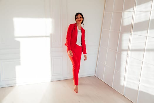 Portrait of a female student in a red business suit