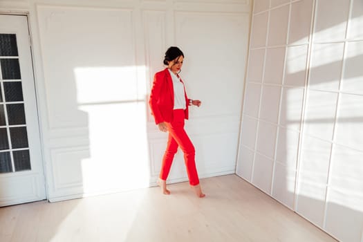 Portrait of a female student in a red business suit