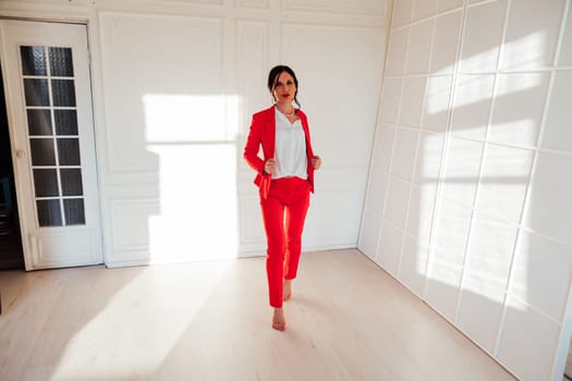 Portrait of a female student in a red business suit