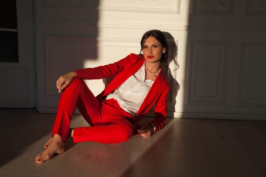 Portrait of a female student in a red business suit