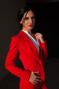 Portrait of a female student in a red business suit