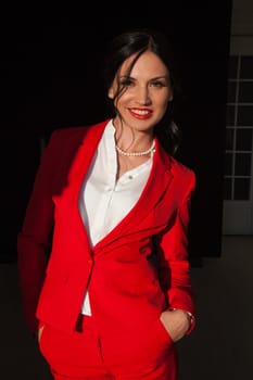 Portrait of a female student in a red business suit