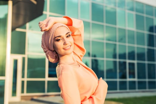 girl in abaya on the background of the business center.