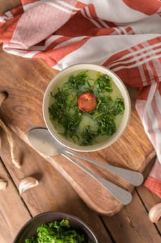 Caldo verde popular soup in Portuguese cuisine. traditional ingredients for caldo verde are potatoes, collard greens , olive oil and salt. Additionally garlic or onion may be added.