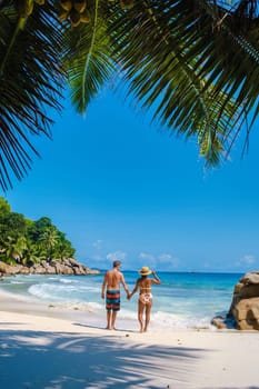 Anse Patates Beach La Digue Island, Seychelles, La Digue Seychelles tropical Island mature couple of men and women on vacation in Seychelles