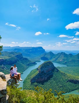 Panorama Route South Africa, Blyde river canyon with the three rondavels, view of three rondavels and the Blyde river canyon in South Africa. Asian women and Caucasian men on vacation in South Africa