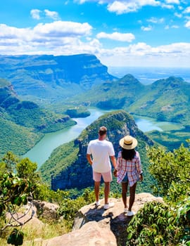 Panorama Route South Africa, Blyde river canyon with the three rondavels, and the Blyde river canyon in South Africa. A couple of Asian women and Caucasian men on vacation in South Africa