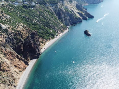 Aerial panoramic view of beautiful sunset above sea. Beautiful seascape. Sun glare, small waves on the water surface. Evening. Horizon. Nobody. No people. Copy space. Never-ending beauty of nature