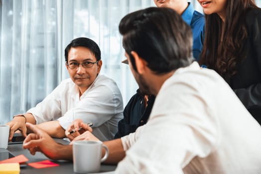 Group of diverse office worker employee working together on strategic business marketing planning in corporate office room. Positive teamwork in business workplace concept. Prudent