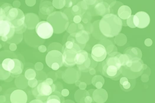 abstract green bokeh background with copy space for text or image.abstract background bokeh circles for Christmas and New Year background.green bokeh abstract light background, circle shape bokeh background.