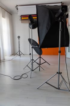 Photographer's equipment flashes in the interior a photo studio