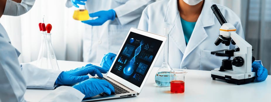 Laboratory research team advance healthcare with scientific expertise, laboratory equipment, and innovative medical biotechnology software, researching new medicines and developing cure.Panorama Rigid