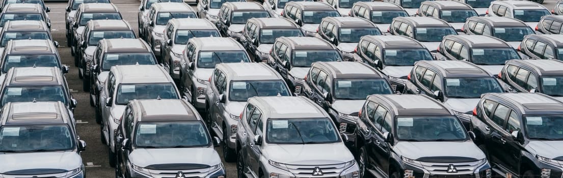 Lamchabang, Thailand - July 02, 2023 In a bustling factory garage, new cars are prepared for parking and transportationa reflection of modern automotive industry and technology.